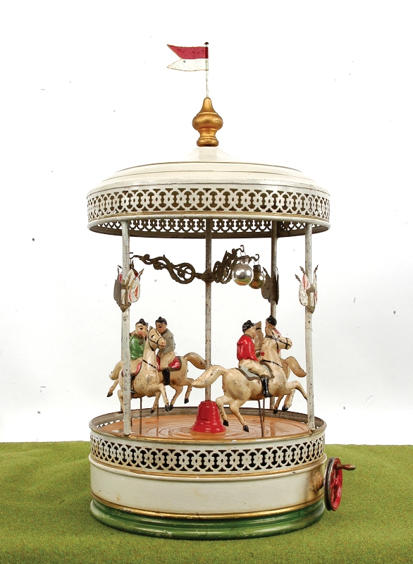 76.  Doll tinplate carousel